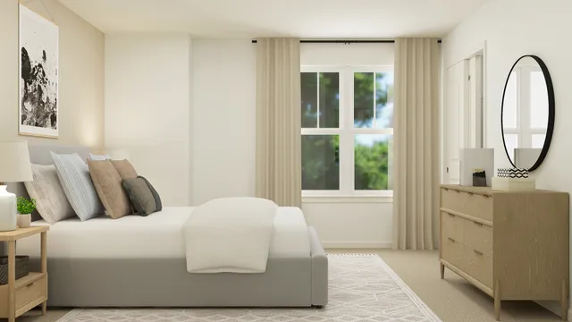 a bedroom with a bed a mirror and a window