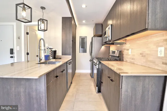 a large bathroom with a granite countertop sink and a mirror