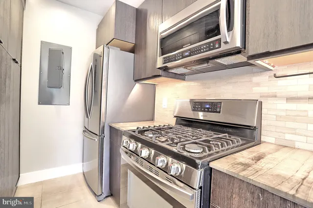 a kitchen with a stove and a microwave