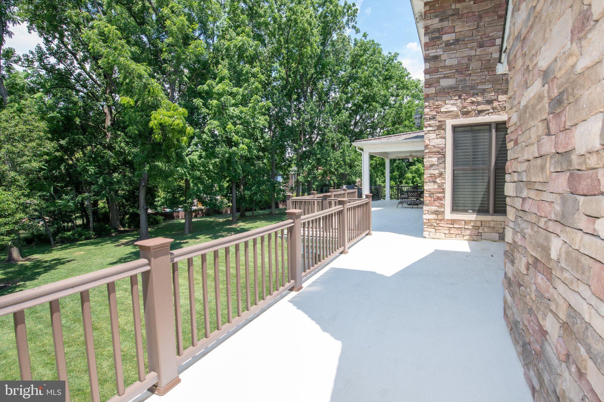 711 Moredon Road Jenkintown, PA 19046 - Photo 116 of 140 Serene patio with lush greenery views.