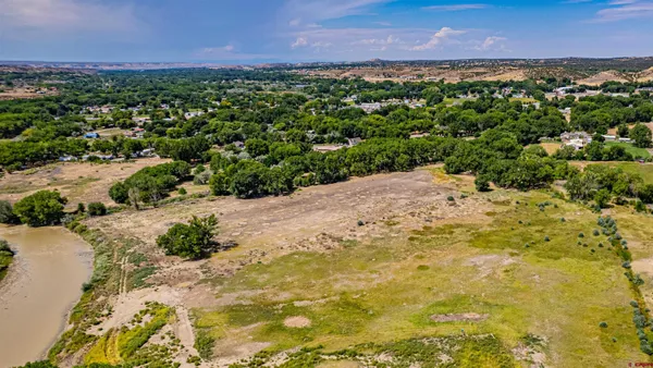 a view of a yard with a lake view