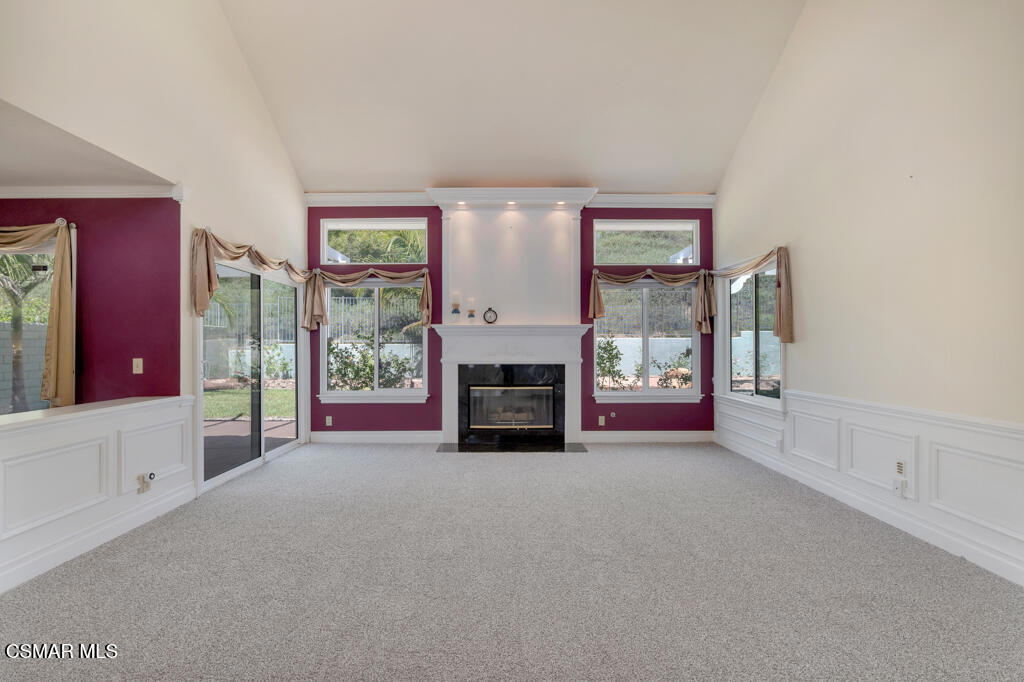 5339 Seneca Place Simi Valley, CA 93063 - Photo 13 of 76 a view of an empty room with a fireplace and a window