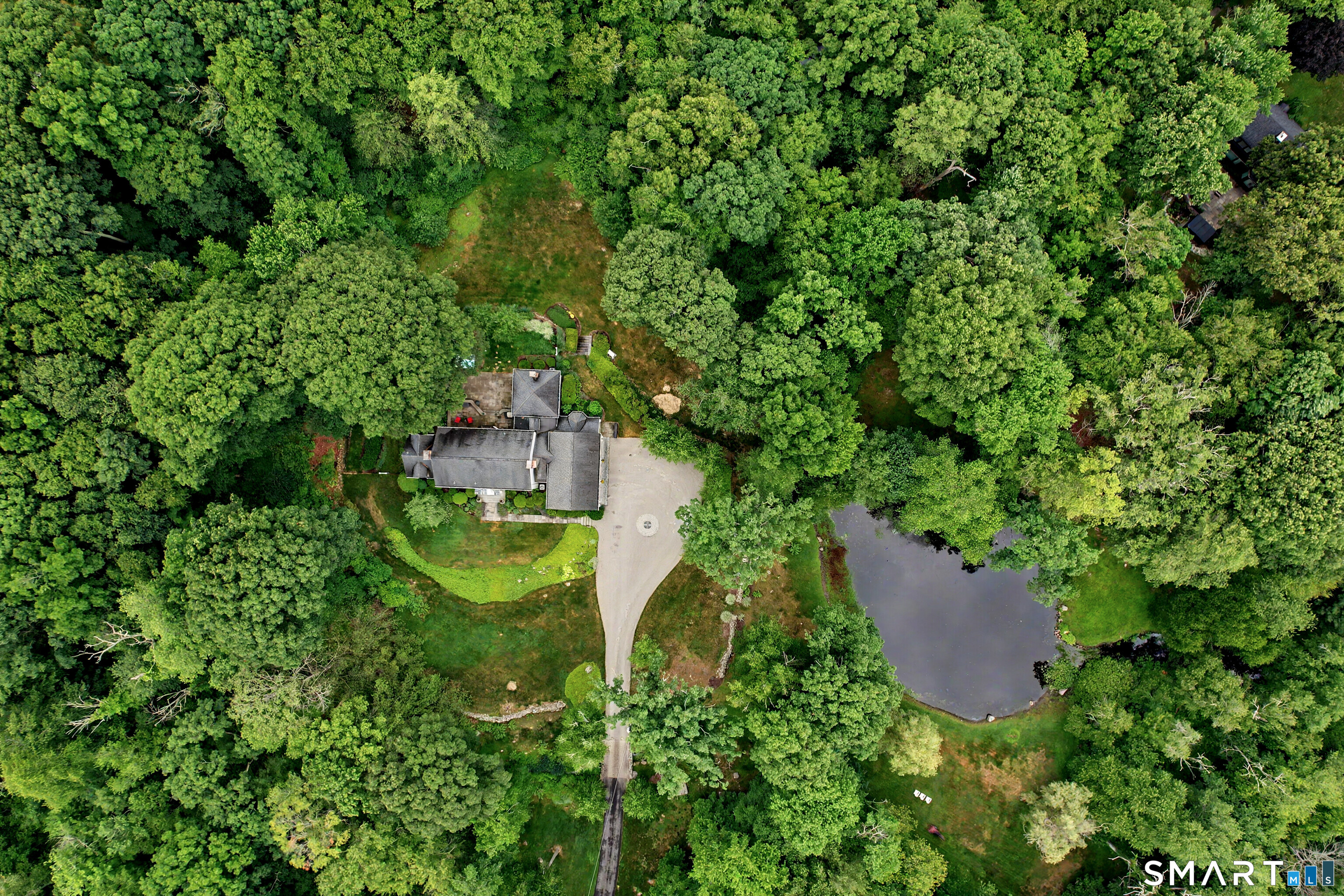 108 Logan Road New Canaan, CT 06840 - Photo 40 of 40 an aerial view of a house with pool outdoor seating and yard