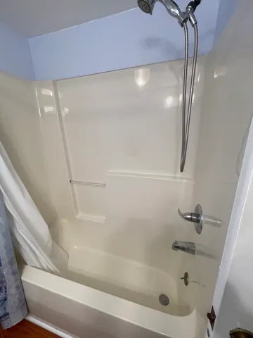 a close view of a bathtub in bathroom