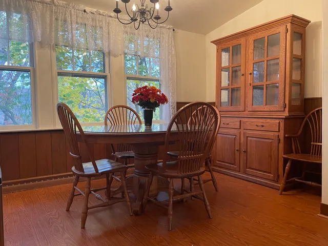 a view of a dining room with furniture window and outside view
