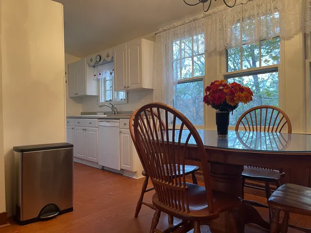 a view of a dining room with furniture window and outside view