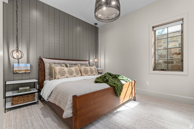 2192 East Outlaw Road Kamas, UT 84036 - Photo 71 of 80 Board and batten accent wall, recessed lighting, textile drum pendant light, single window with wood trim, and light-colored carpeting