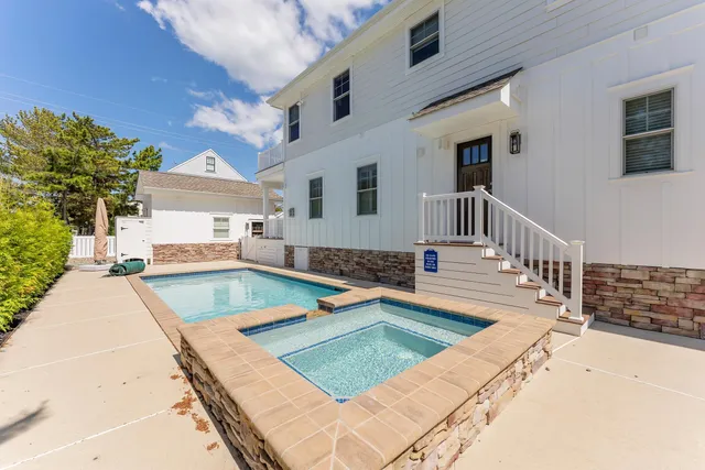 a view of a swimming pool with a patio