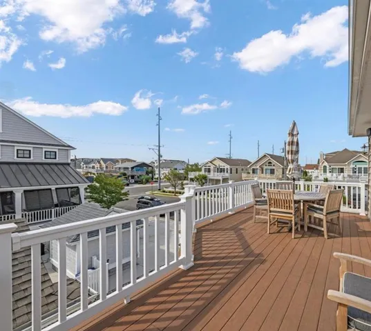 a view of a balcony with chairs