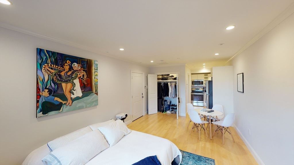 a bedroom with a bed and a table