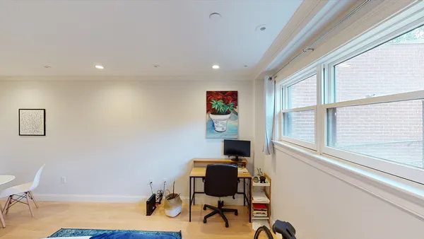 a workspace with furniture and a window