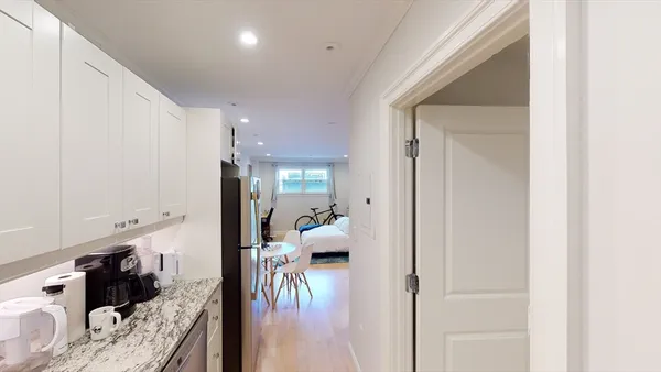 a en suite bathroom with a tub shower and a sink