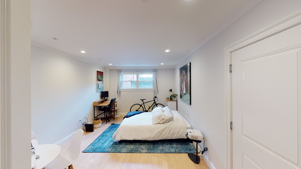 296 Beacon Street, Unit 2 Boston, MA 02116 - Photo 8 of 13 a living room with furniture and a wooden floor