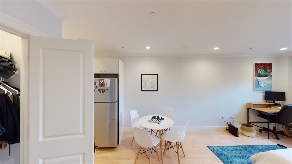 296 Beacon Street, Unit 2 Boston, MA 02116 - Photo 9 of 13 a livingroom with furniture and a couch