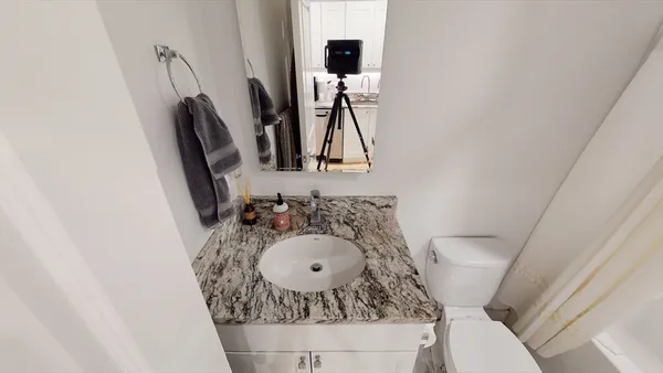 a bathroom with a sink and a mirror