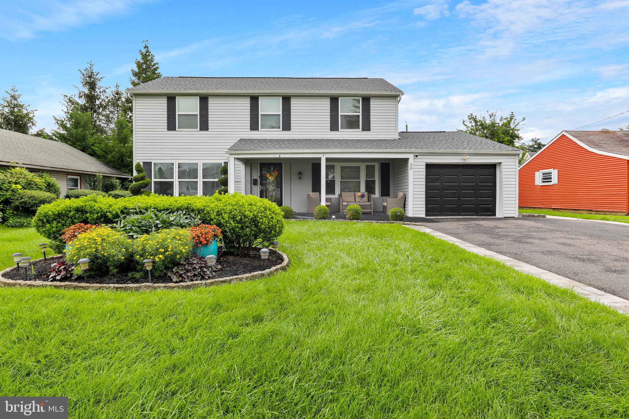 20 Pebble Lane Willingboro, NJ 08046 - Photo 1 of 38 a front view of a house with a garden and yard