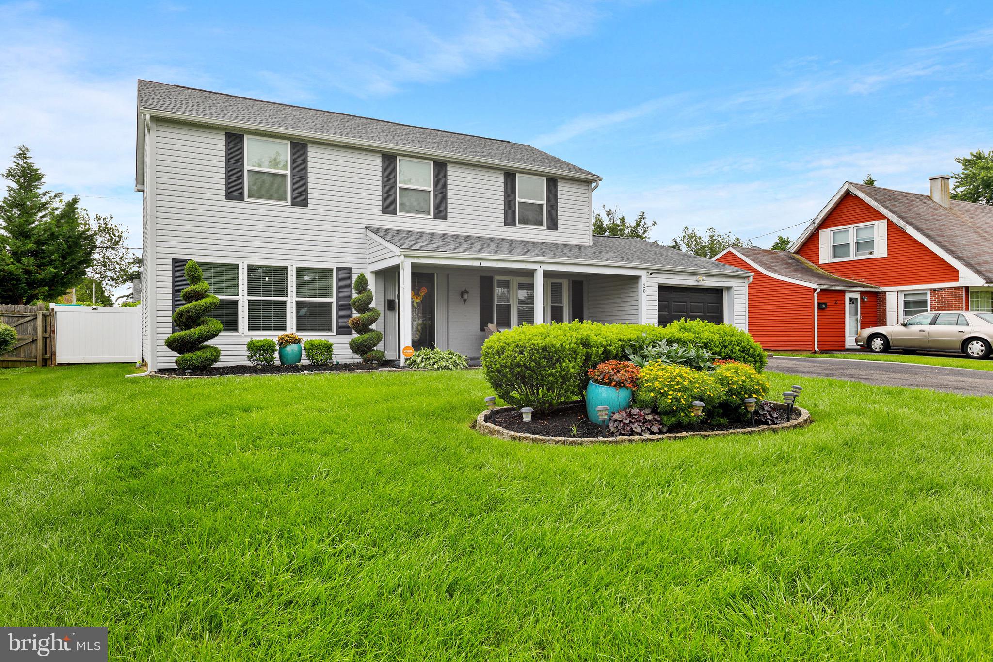 20 Pebble Lane Willingboro, NJ 08046 - Photo 2 of 38 a front view of a house with a yard and garage
