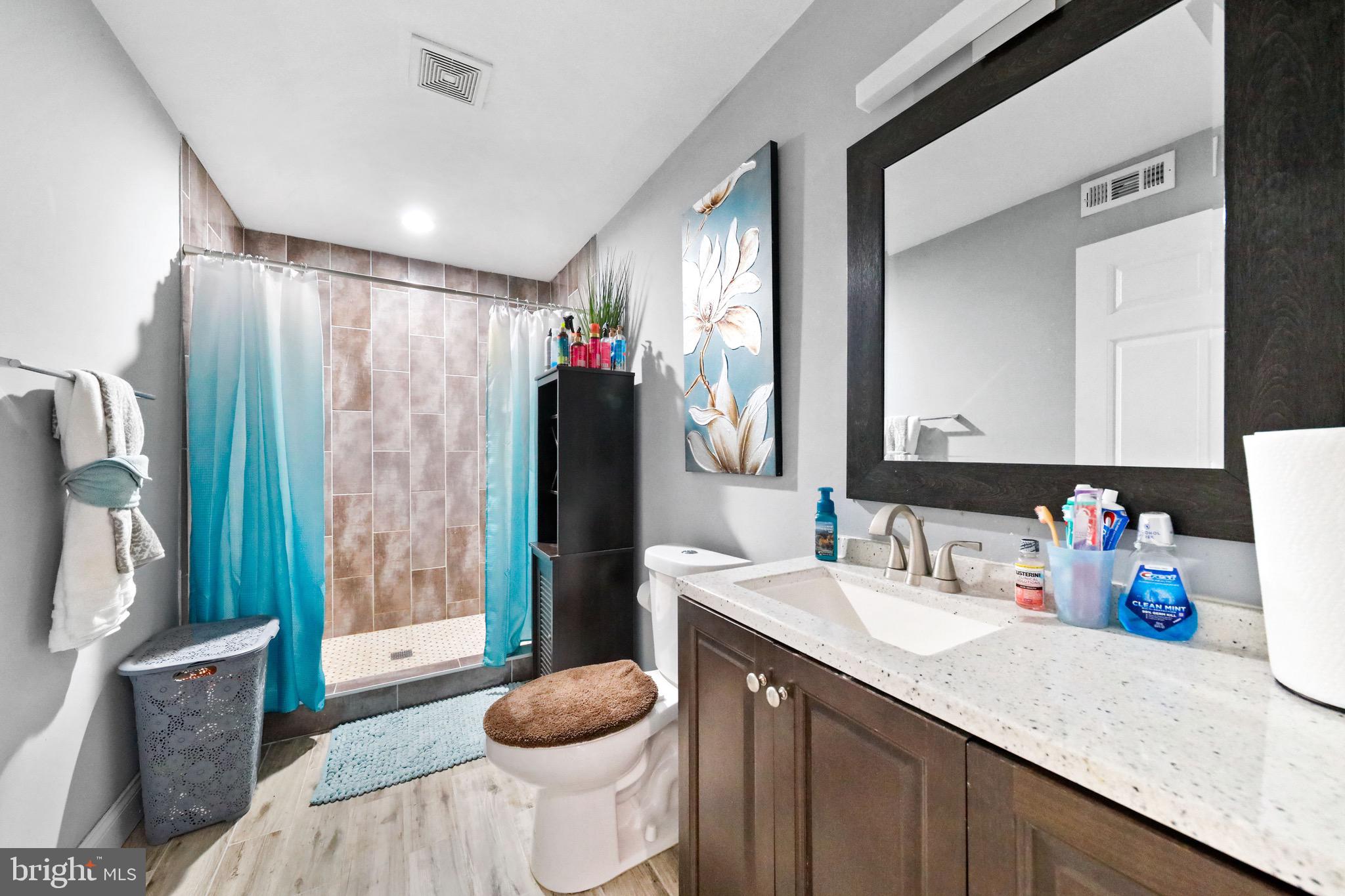 20 Pebble Lane Willingboro, NJ 08046 - Photo 23 of 38 a bathroom with a granite countertop sink toilet and shower