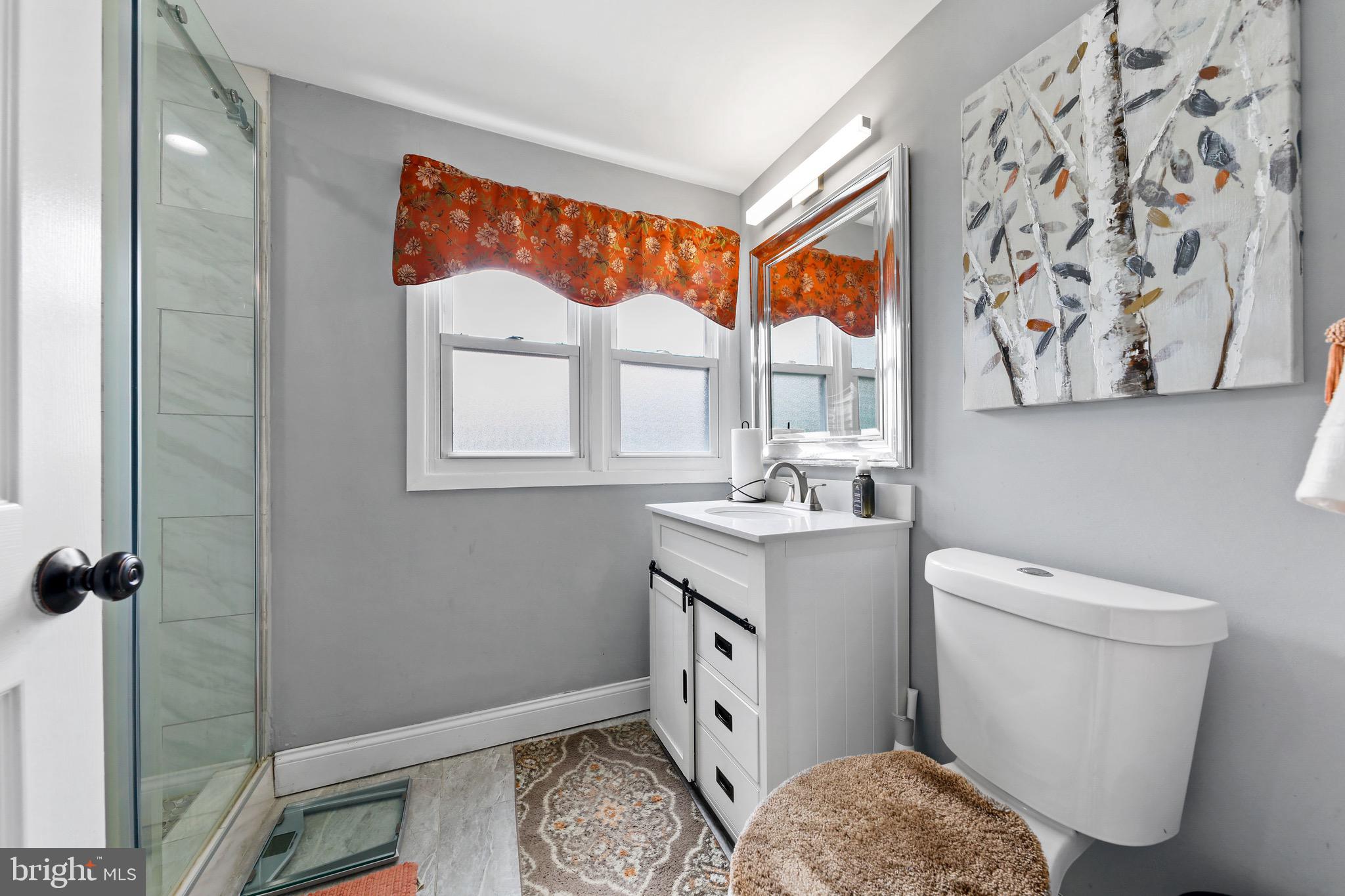 20 Pebble Lane Willingboro, NJ 08046 - Photo 26 of 38 a bathroom with a toilet sink and mirror