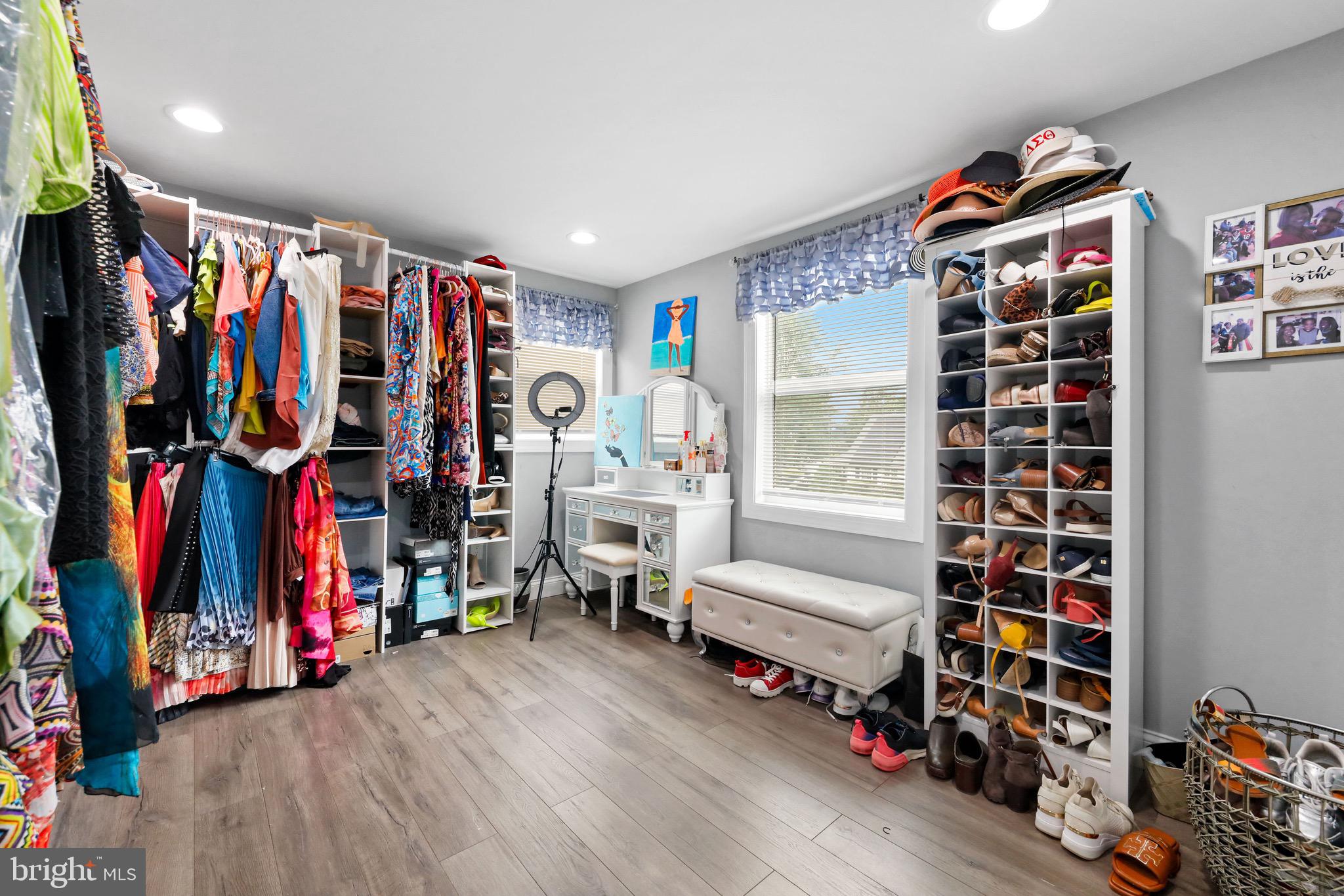 20 Pebble Lane Willingboro, NJ 08046 - Photo 31 of 38 a view of walk in closet with clothes and shoes