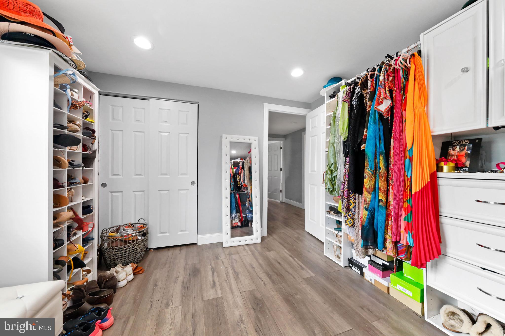 20 Pebble Lane Willingboro, NJ 08046 - Photo 32 of 38 a view of walk in closet with clothes and shoes