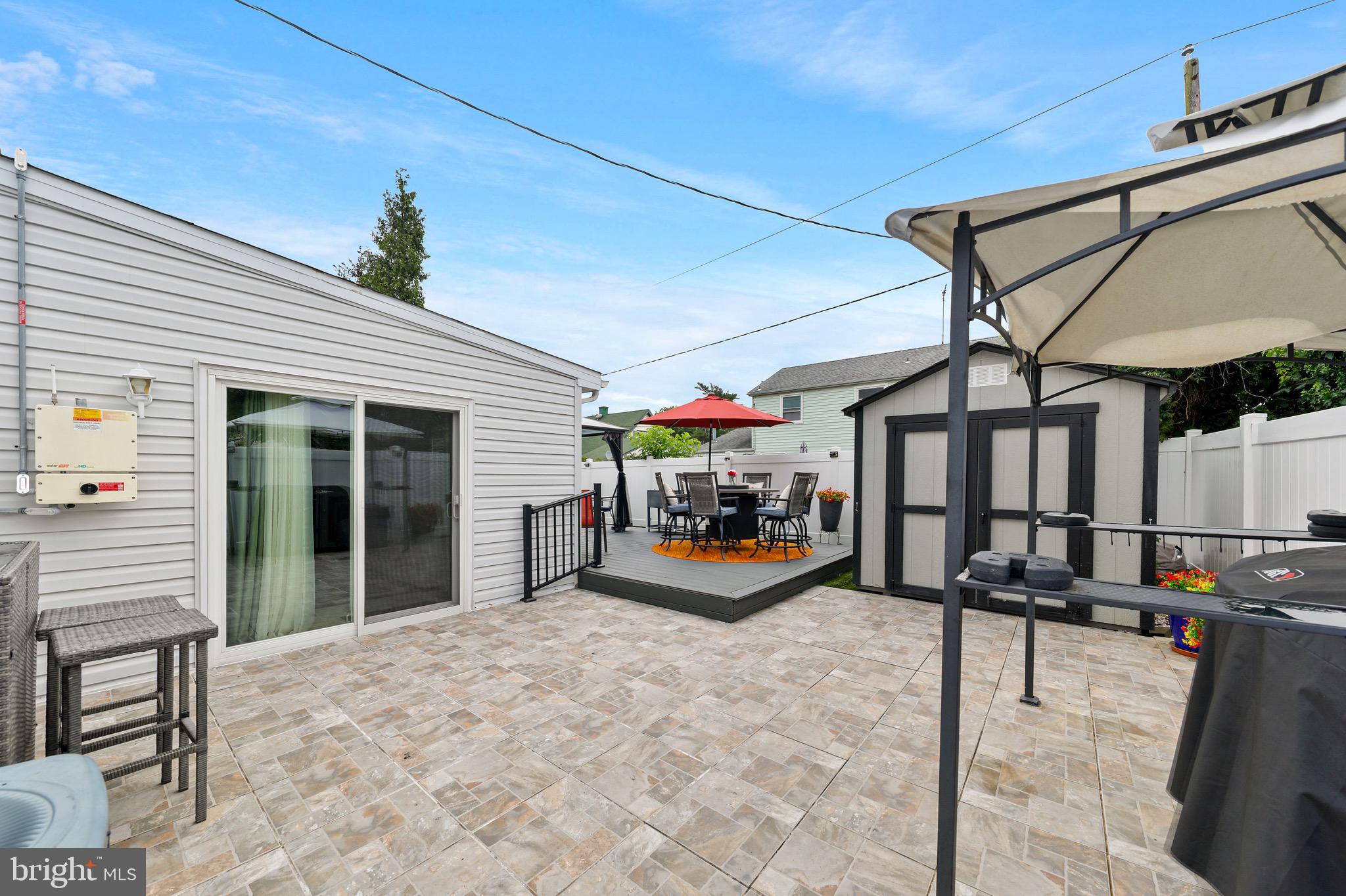 20 Pebble Lane Willingboro, NJ 08046 - Photo 33 of 38 a view of a chairs and tables in the patio