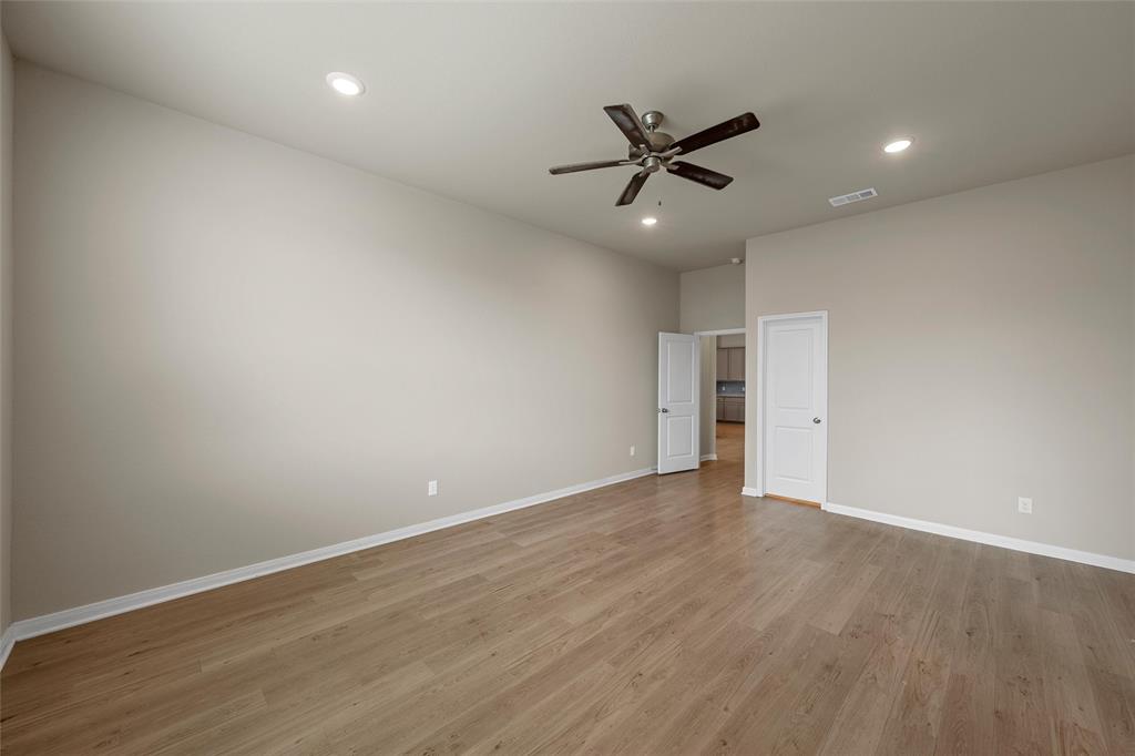 3205 Dottavio Road Lorena, TX 76655 - Photo 15 of 33 a view of an empty room with wooden floor and a window