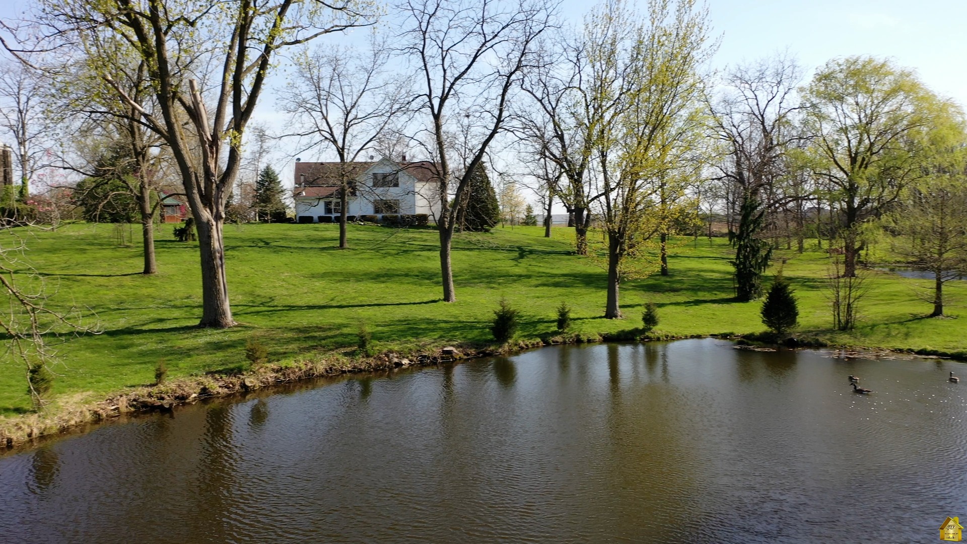 a view of a lake with a house in the background