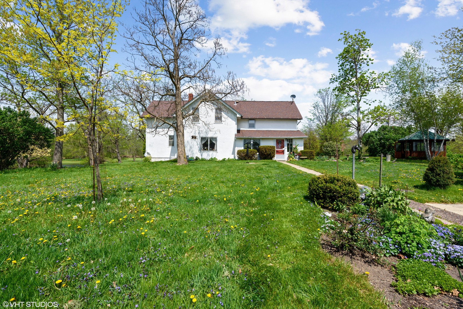 37W793 Binnie Road Dundee, IL 60118 - Photo 4 of 34 a view of a white house with a big yard and large trees