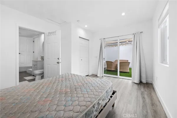 a view of a patio with table and chairs and potted plants
