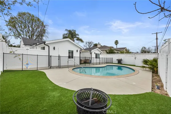 a front view of a house with swimming pool