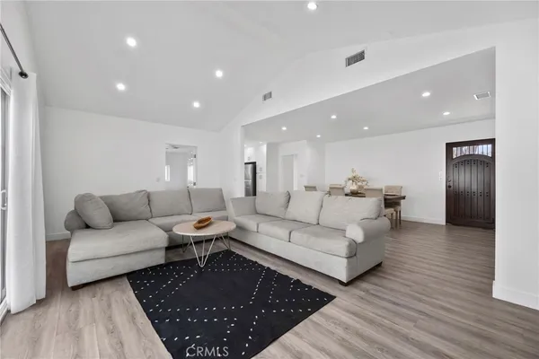 a living room with furniture and a rug