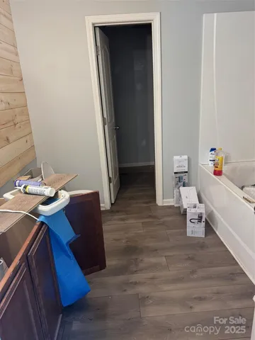 a bedroom with a bed and a table