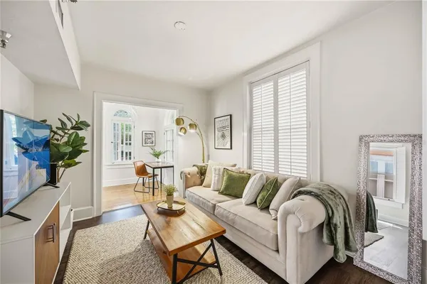 a living room with furniture and a large window