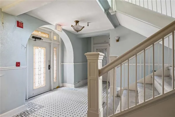 a view of a hallway with a front door