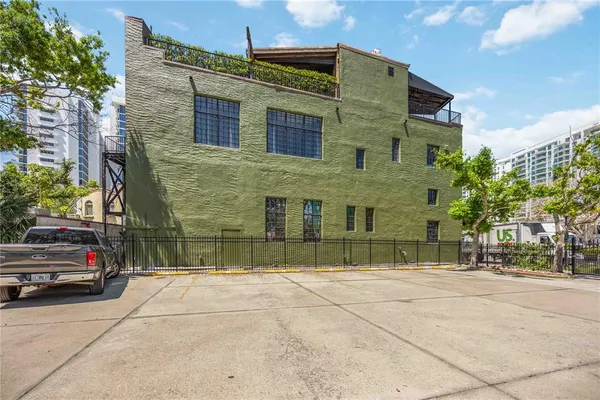 a car parked in front of a brick building