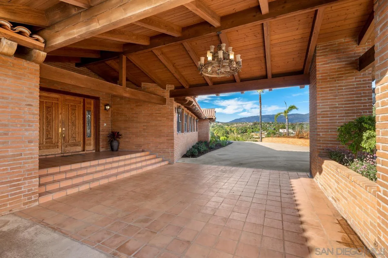 15718 Fruitvale Road Valley Center, CA 92082 - Photo 13 of 49 a view of a porch with a table and chairs