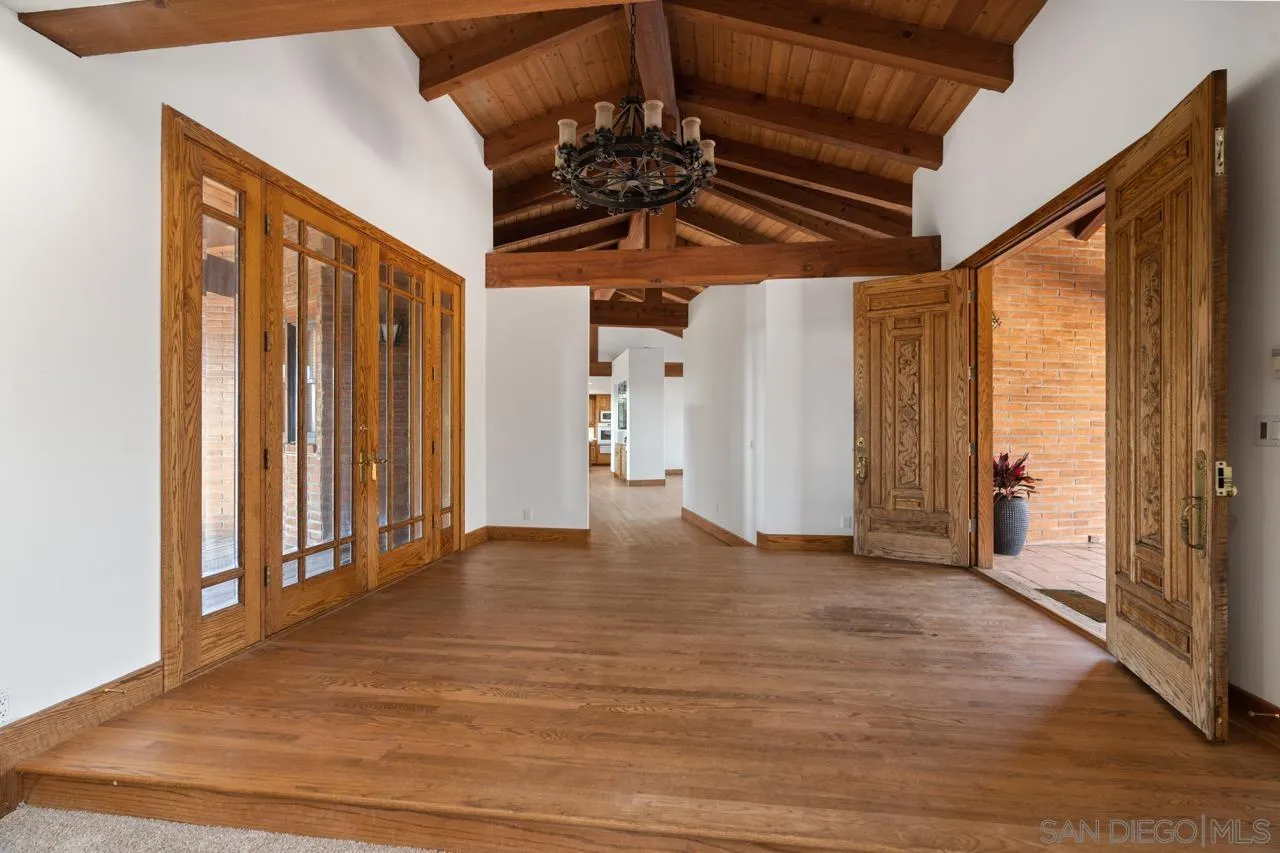 15718 Fruitvale Road Valley Center, CA 92082 - Photo 14 of 49 a view of a room with wooden floor and stairs
