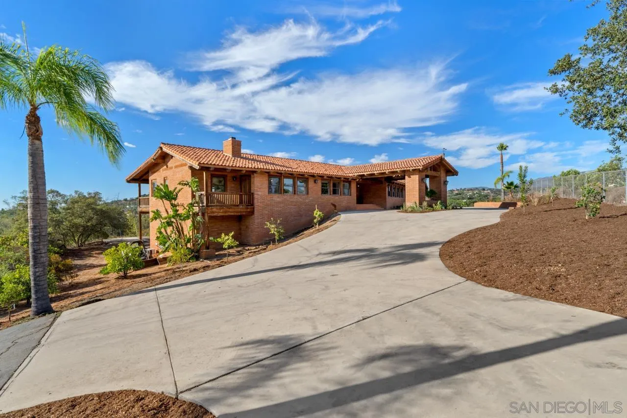 15718 Fruitvale Road Valley Center, CA 92082 - Photo 2 of 49 a view of a house with a street