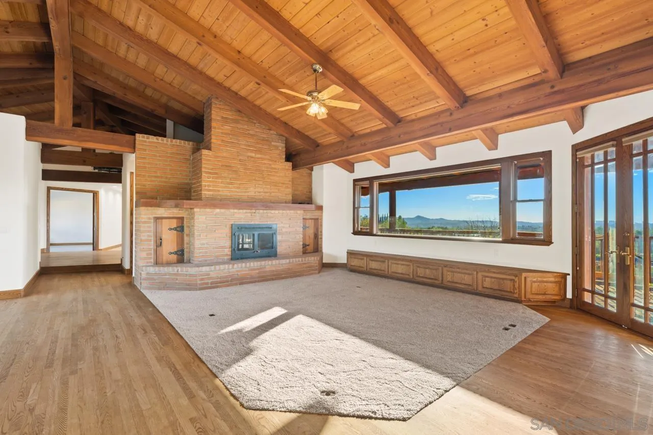 15718 Fruitvale Road Valley Center, CA 92082 - Photo 21 of 49 a view of a living room with a wooden floor