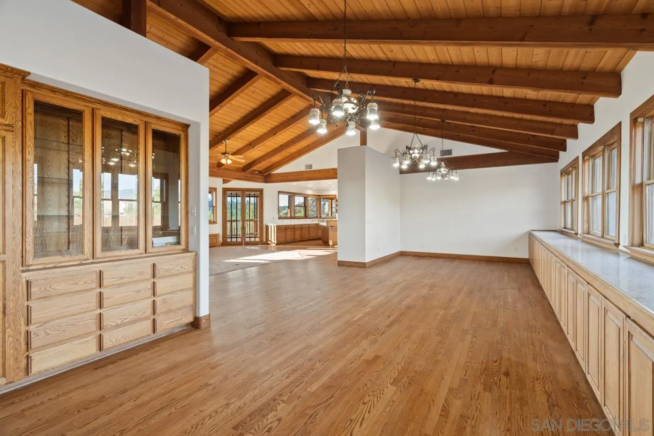 15718 Fruitvale Road Valley Center, CA 92082 - Photo 23 of 49 wooden floor in an empty room with a window