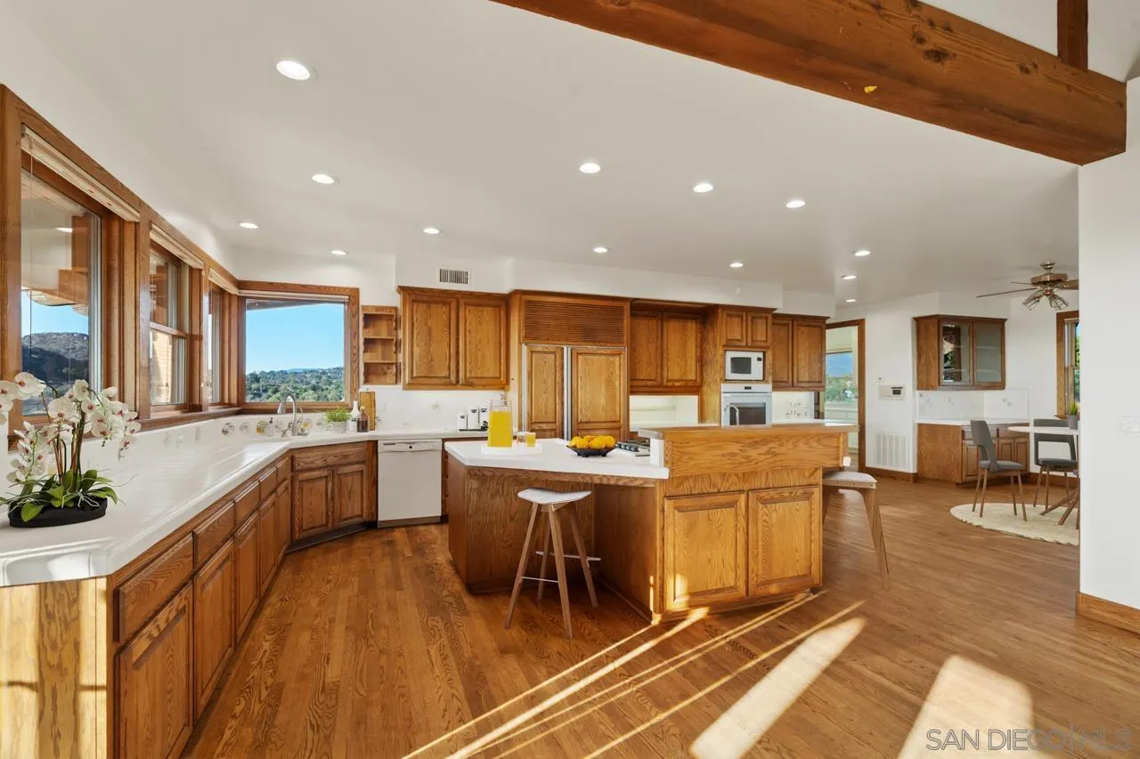 15718 Fruitvale Road Valley Center, CA 92082 - Photo 27 of 49 a large kitchen with lots of counter top space and stainless steel appliances