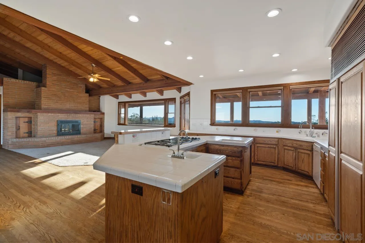 15718 Fruitvale Road Valley Center, CA 92082 - Photo 30 of 49 a kitchen with a sink and cabinets