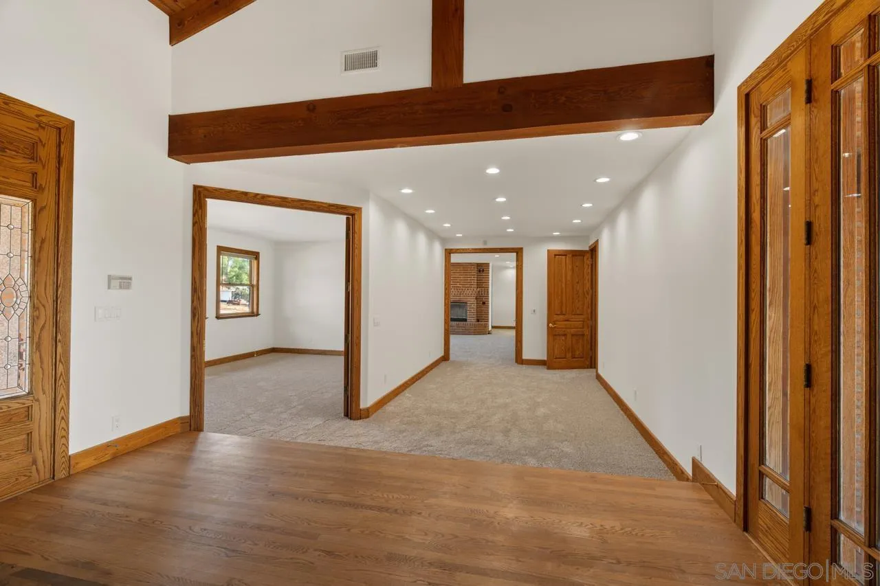 15718 Fruitvale Road Valley Center, CA 92082 - Photo 33 of 49 a view of a hallway with wooden floor