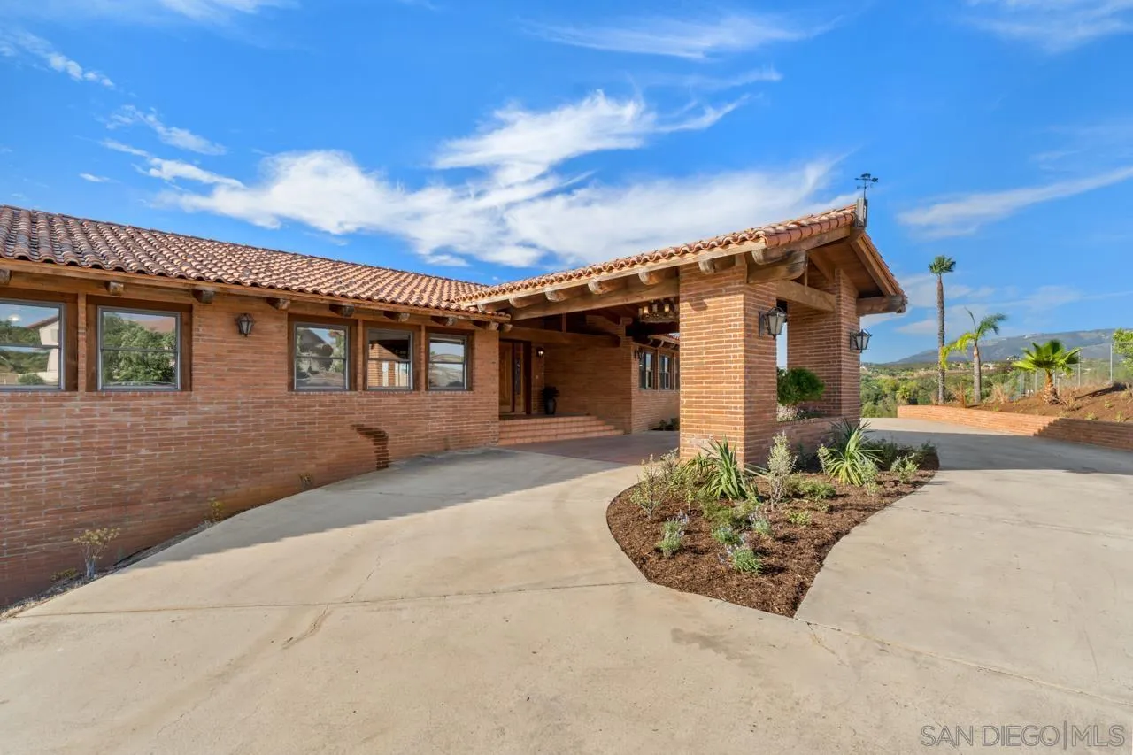 15718 Fruitvale Road Valley Center, CA 92082 - Photo 4 of 49 front view of a house with a street