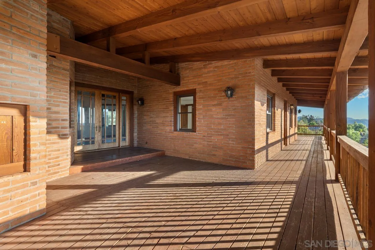 15718 Fruitvale Road Valley Center, CA 92082 - Photo 42 of 49 a view of a porch with wooden floor and stairs