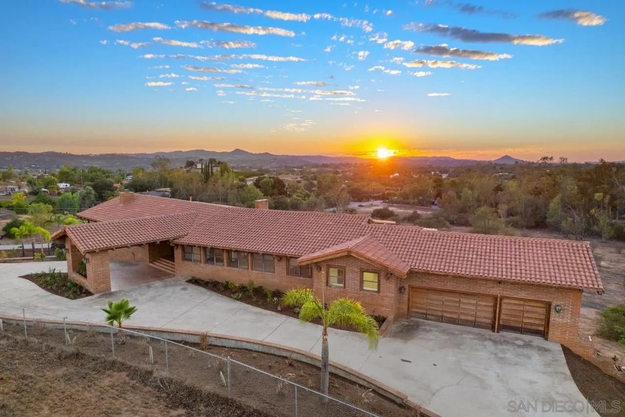 15718 Fruitvale Road Valley Center, CA 92082 - Photo 48 of 49 a view of a house with a yard and table