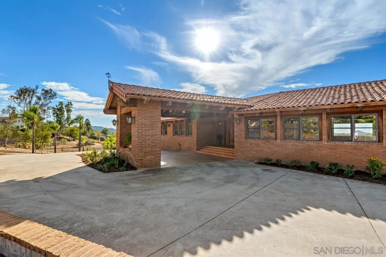 15718 Fruitvale Road Valley Center, CA 92082 - Photo 5 of 49 a view of a house with a patio
