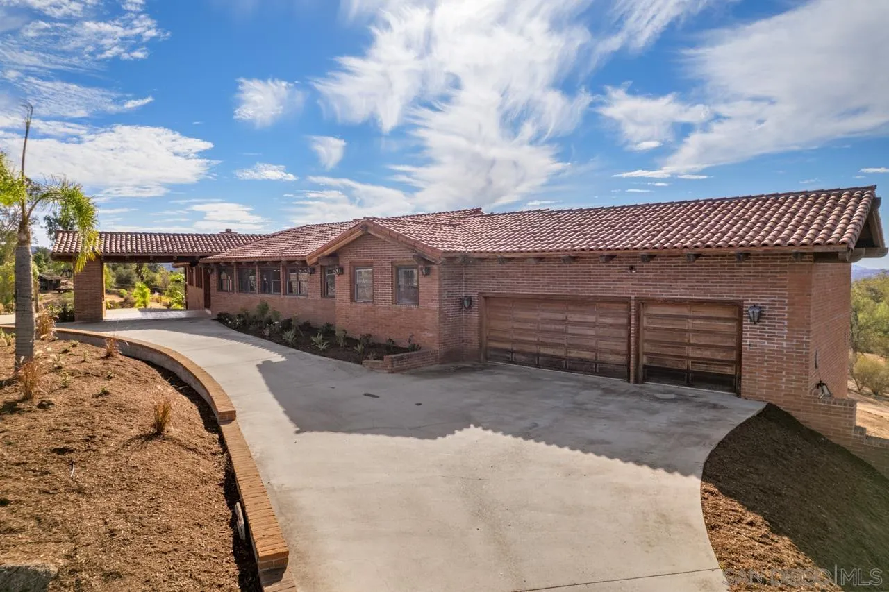 15718 Fruitvale Road Valley Center, CA 92082 - Photo 6 of 49 a view of a house with a patio