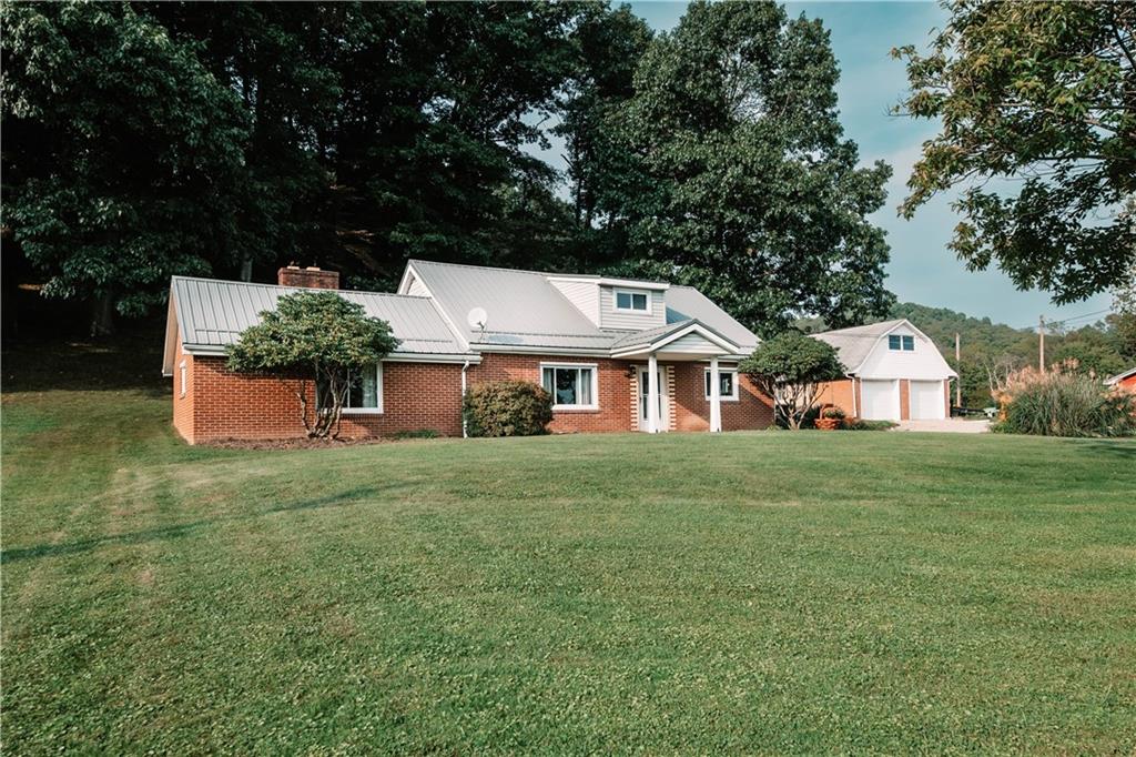 64 North Ridge Road Shelocta, PA 15774 - Photo 3 of 25 a front view of a house with a garden